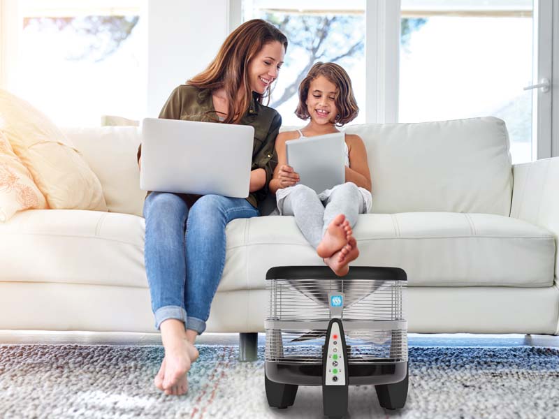 Power360™️ as a footrest for a Mother and Daughter with Laptop and Tablet on a Couch