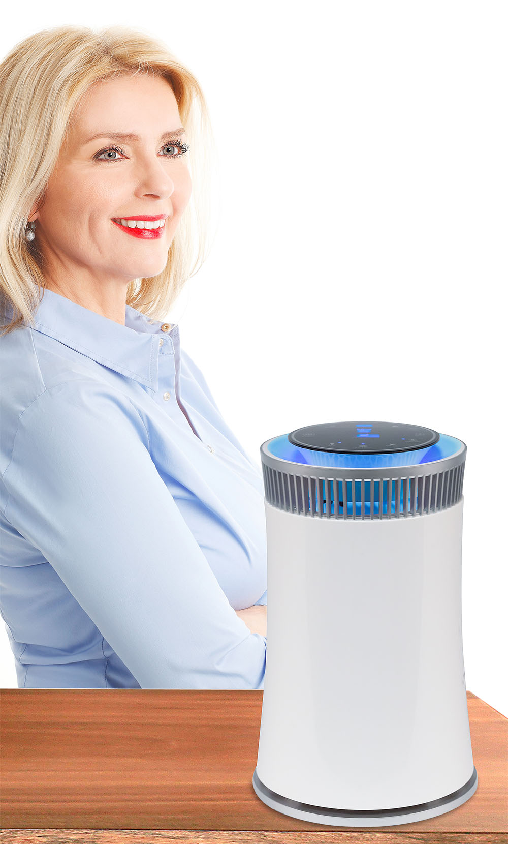 Woman standing next to a SafeAYR™ Purifier on a table